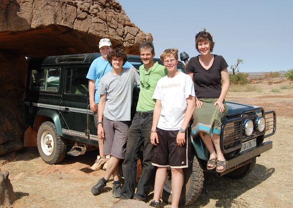 Photo of Higby family, taken in front of their Land Rover